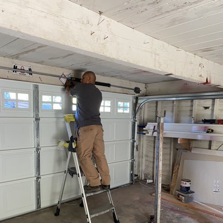 experts installing garage door
