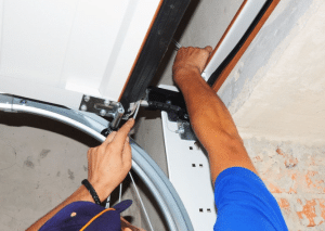 expert repairing a garage door